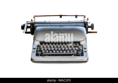 A broken and dilapidated 1960s Adler manual typewriter isolated on a white background Stock Photo