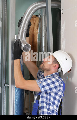 Mounting a ventilation technology on construction site Stock Photo