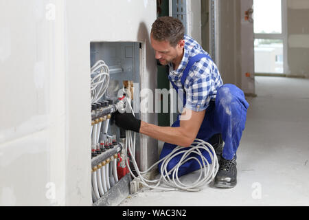 A Installation distributor underfloor heating Stock Photo