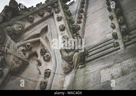 A close up of a carved stone figure and decoration on the tower of the University church of St Mary the Virgin, Oxford, England UK. Stock Photo