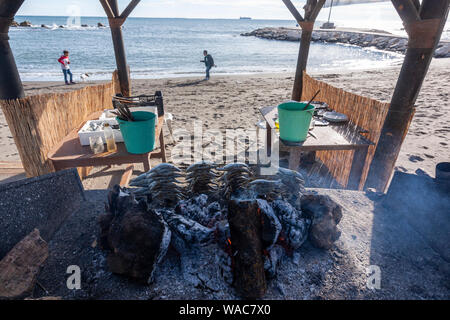 Preparing espeto de sardinas, sardine spit, Restaurante El Cabra , Pedregalejo, Malaga, Andalucia, Spain Stock Photo