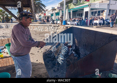 Preparing espeto de sardinas, sardine spit, Restaurante El Cabra , Pedregalejo, Malaga, Andalucia, Spain Stock Photo