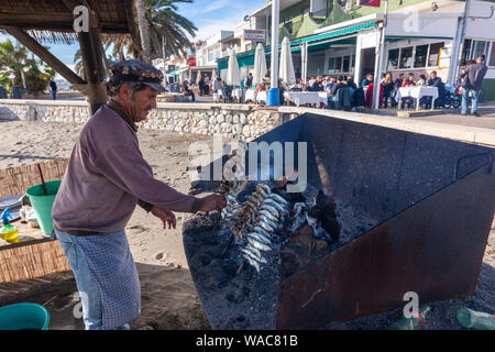 Preparing espeto de sardinas, sardine spit, Restaurante El Cabra , Pedregalejo, Malaga, Andalucia, Spain Stock Photo