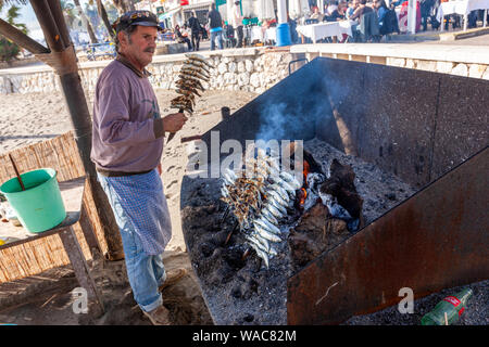 Preparing espeto de sardinas, sardine spit, Restaurante El Cabra , Pedregalejo, Malaga, Andalucia, Spain Stock Photo