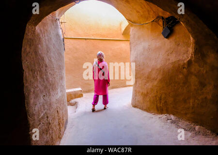 Woman in an old quarter Street. Stock Photo