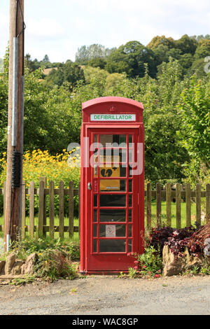 A defibrillator for public use housed in an old British telephone box. Stock Photo