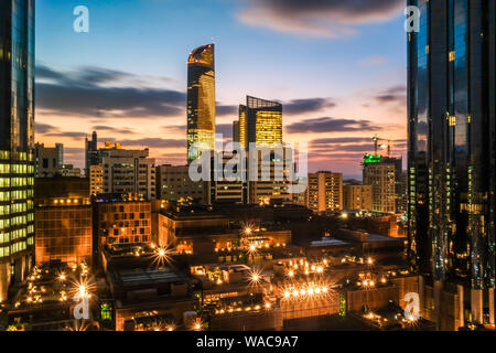 Abu Dhabi city epic sunset clouds - city skyline and modern skyscrapers - World Trade Center Towers at night Stock Photo