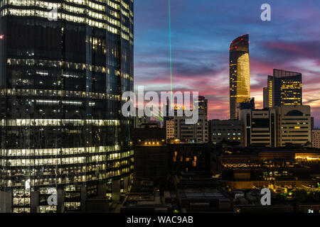 Abu Dhabi city epic sunset clouds - city skyline and modern skyscrapers - World Trade Center Towers at night Stock Photo