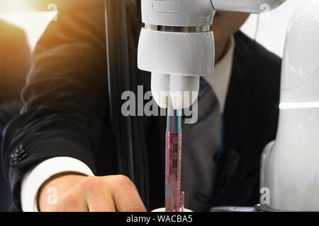 Industry 4.0, 5.0 Collaborative robot technology , new relationship between man and robot hand machine ,mass personalization, productivity customizati Stock Photo