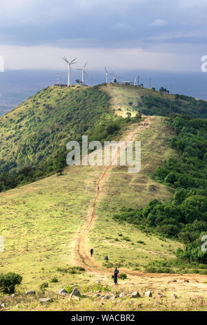 Ngong Hills Nature Reserve with hiking trails and wind power plant turbines in background, Kenya Stock Photo