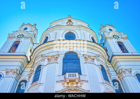 The monumental facade of Kollegienkirche (Collegiate church) in baroque style with two bell towers on University Square of Salzburg, Austria Stock Photo