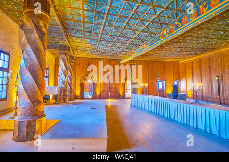 SALZBURG, AUSTRIA - FEBRUARY 27, 2019: The large Golden Hall of Hohensalzburg Castle with preserved wooden ceilings with colorful coat of arms and gol Stock Photo