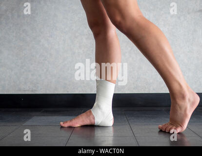 Inversion ankle sprain tape job in action Stock Photo