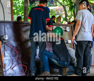 latin electrical students working on project at college in Guatemala Stock Photo
