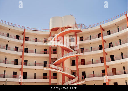 From below white hotel building with spiral staircase in Tenerife on daytime Stock Photo