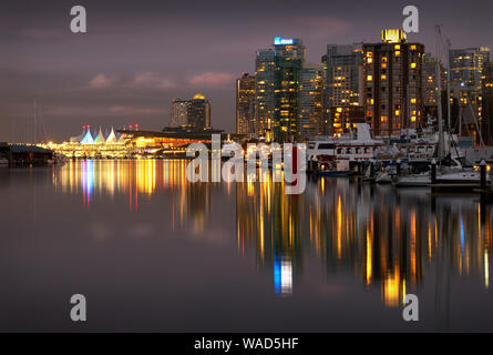 Coal Harbour Twilight Lights. The Vancouver skyline reflects in Coal Harbour at night. British Columbia, Canada. Stock Photo