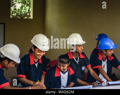 male and female students working on project in Guatemalan school Stock Photo