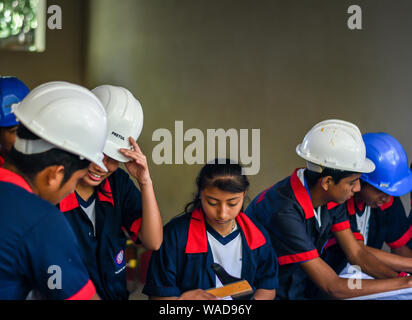 male and female students working on project in Guatemalan school Stock Photo