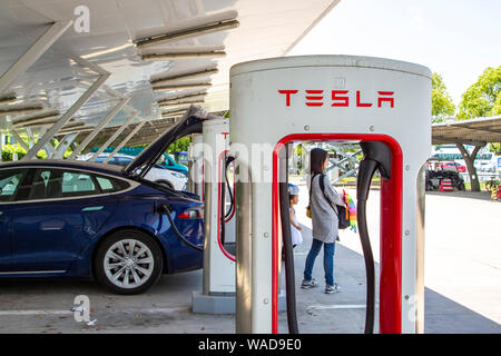 --FILE--Charging piles are seen at a Tesla charging station in Shanghai, China, 3 May 2019.   U.S. electric car maker Tesla said Wednesday that it had Stock Photo