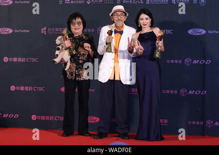 (From left) Taiwanese actress Yin-Shang, actor Hsiao Hou Tao, and actress Li Yi-jie pose with their trophies after winning Best Actress and Best Actor Stock Photo