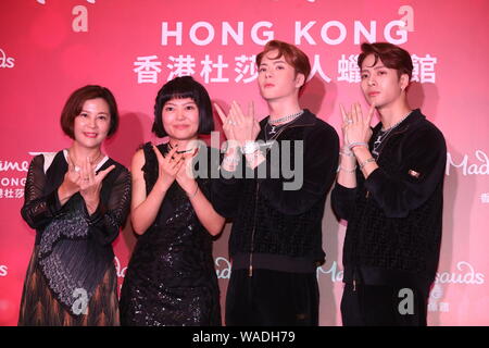 Hong Kong singer and actor Jackson Wang, right, of South Korean boy group GOT7, poses with a wax figure of him during an unveiling ceremony at Madame Stock Photo