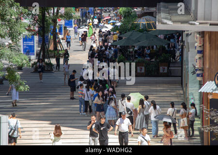 Queue Inchina Chinese fans wait in a long queue in front of a milk tea store operated ...