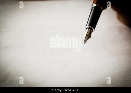 Old fountain pen on paper sheets with copy space Stock Photo