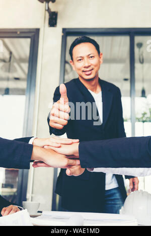 Team meeting introduce company worker in conference room. Diversity of Friend and student in Teams. Partner Team Shake hands together. Business Meetin Stock Photo