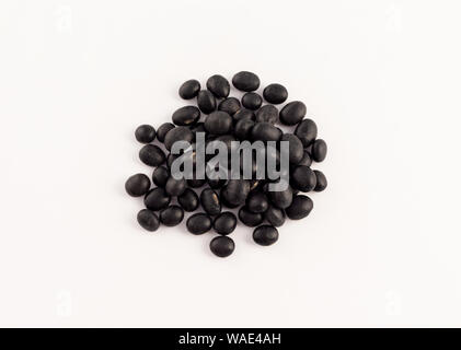 group of dried black beans on white background Stock Photo