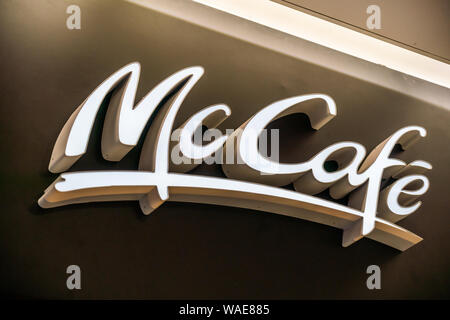 McCafé logo, a coffee-house-style food and beverage chain owned by McDonald's, seen in Shanghai Hongqiao International Airport. Stock Photo