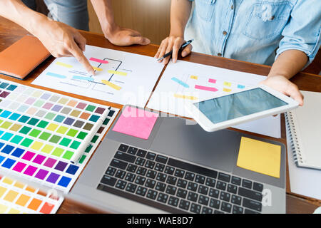 business technology concept, creative team designer choosing samples with UI/UX developing on sketch layout design mockup on smartphone application fo Stock Photo