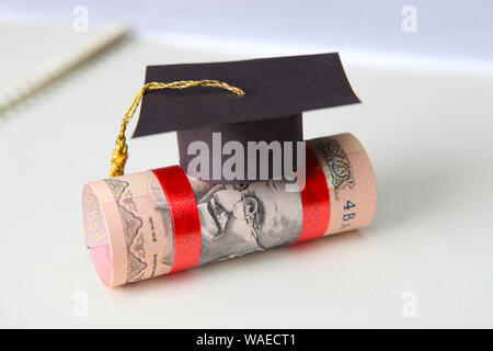 Close up of a mortar board on Indian currencies Stock Photo