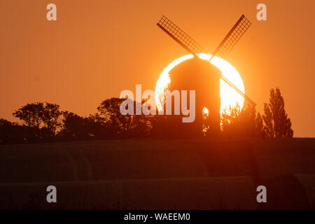The sun rises over Chesterton Windmill in Chesterton, Warwickshire. Stock Photo