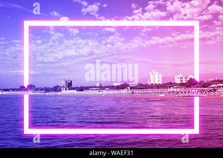Seascape the horizon in shades of neon with white square frame. Pattern, background. Fantasy filtered shot. Copy space. Stock Photo