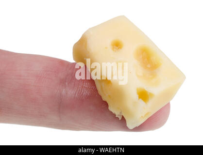 In the future we will eat this concept - small ugly bad old cheese piece on finger. Isolated on white studio macro Stock Photo