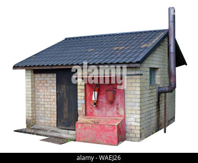 Simple  no name yellow bricks  forest  rural shed used as a bath and for storage of firewood and agricultural tools. Isolated Stock Photo