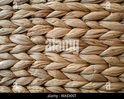 Light brown heavily textured abstract background of raffia wicker Stock Photo