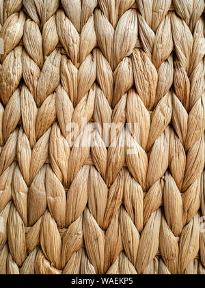 Light brown heavily textured abstract background of raffia wicker Stock Photo