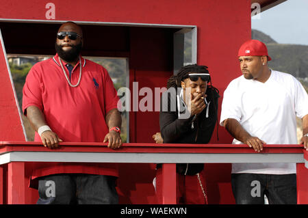 (L-R) Rappers Rick Ross, Lil Wayne and Mack 10 on-set at the Mack 10 ft. Lil Wayne, and Rick Ross 'So Sharp' music video shoot in Malibu. Stock Photo