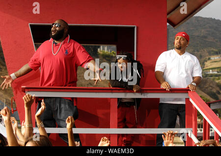 (L-R) Rappers Rick Ross, Lil Wayne and Mack 10 on-set at the Mack 10 ft. Lil Wayne, and Rick Ross 'So Sharp' music video shoot in Malibu. Stock Photo