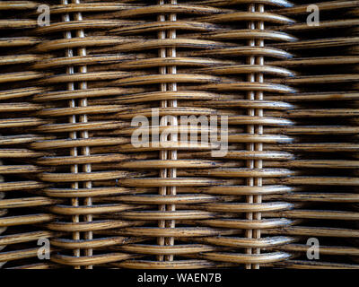 Light brown heavily textured abstract background of woven wicker Stock Photo