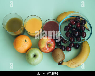 Close-up photography from above of different ingredients to make a healthy meal. Vegetable and fruit juices Stock Photo