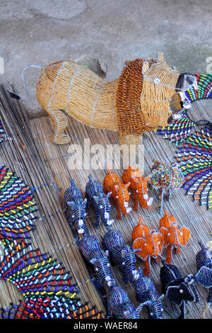 Beaded jewellery and animals sold as souvenirs on display at Lesedi Cultural Village, Cradle of Humankind, South Africa Stock Photo