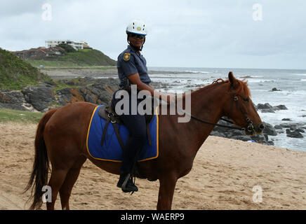 South African police woman on horseback, Gonubie beach, East London, South Africa Stock Photo