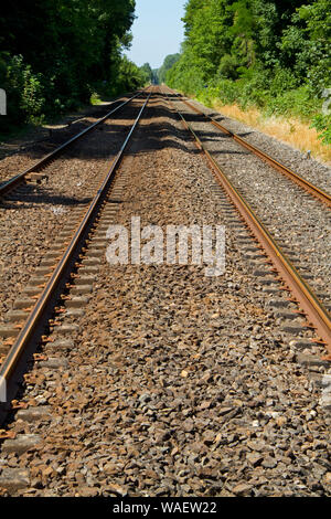 Railroad tracks on concrete sleepers and ballast bed Stock Photo