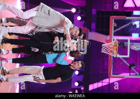 Dwyane Wade, the second from the right, and Bai Jingting, front middle, participate into the Chinese variety show, Dunk of China, in Beijing China, 20 August 2019. Dwyane Wade, an American former professional basketballplayer, shows up at the venue of a Chinese variety show, Dunk of China, with Bai Jingting, a Chinese actor who is basketball lover, in Beijing China, 20 August 2019. Wade and Bai play the roles of coaches in the show and help amateur basketball players. Stock Photo