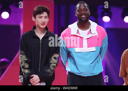 Dwyane Wade, right, and Bai Jingting, left, participate into the Chinese variety show, Dunk of China, in Beijing China, 20 August 2019. Dwyane Wade, an American former professional basketballplayer, shows up at the venue of a Chinese variety show, Dunk of China, with Bai Jingting, a Chinese actor who is basketball lover, in Beijing China, 20 August 2019. Wade and Bai play the roles of coaches in the show and help amateur basketball players. Stock Photo