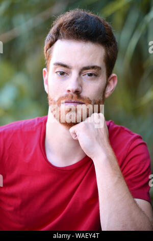 Handsome young man with red hair Stock Photo