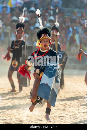 NAGALAND, INDIA, December 2013, Naga Warrior performing games during Hornbill Festival. Stock Photo
