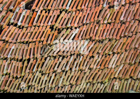 Stack of roof tiles, bricks arranged, full frame Stock Photo